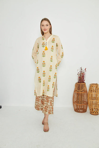 Cream printed long kurta with long sleeves and matching orange patterned palazzo pants