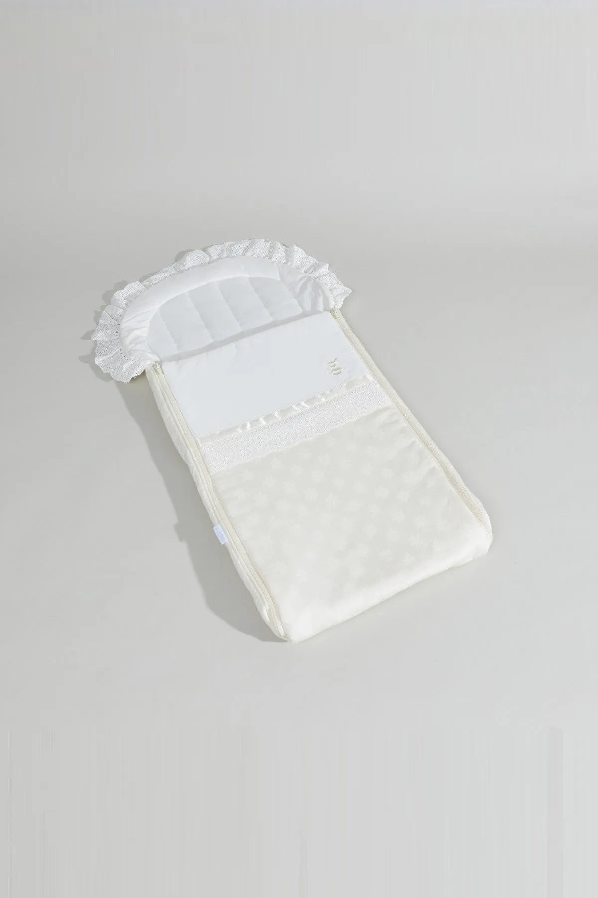 BABYSHOP cream newborn swaddle blanket with ruffled top and textured fabric