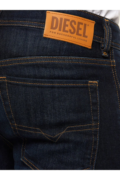 Diesel logo patch on blue denim jeans waistband, with orange topstitching.