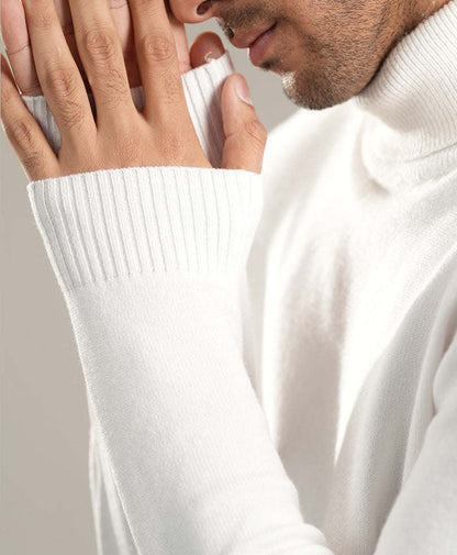 White turtleneck sweater sleeve and ribbed cuff close-up