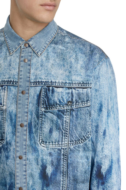 Light blue denim shirt close-up: button placket and flap chest pocket