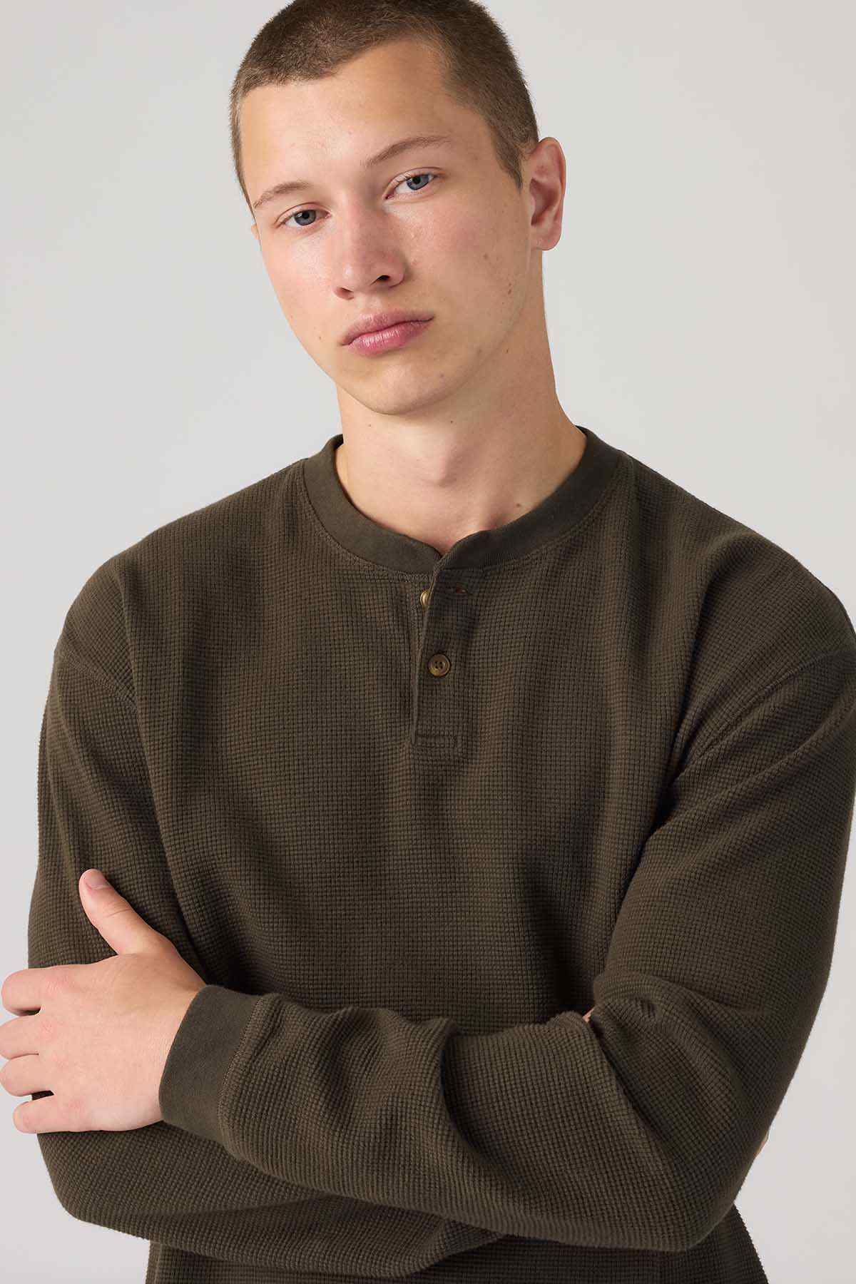 Brown long-sleeve henley with front buttons and ribbed cuffs