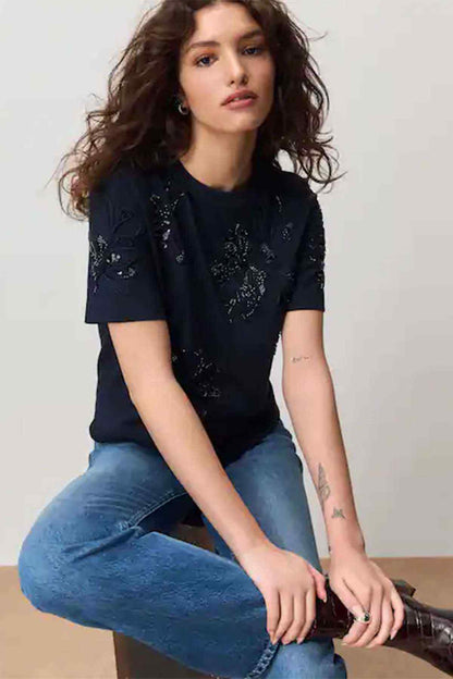 Navy short-sleeve top with detailed bow and floral embroidery