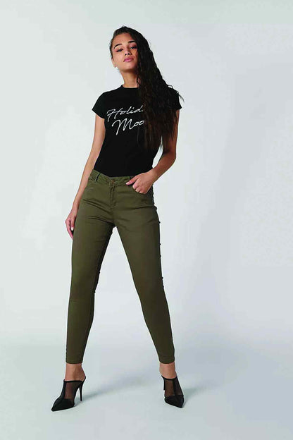 Olive green slim-fit jeans with five-pocket design and belt loops