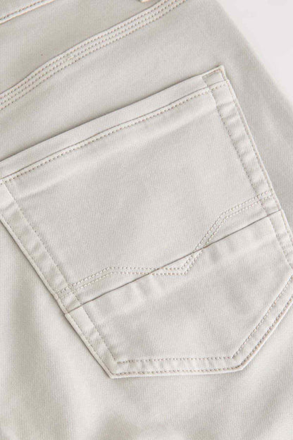 Men's stone pants with embroidered back pocket and curved stitching