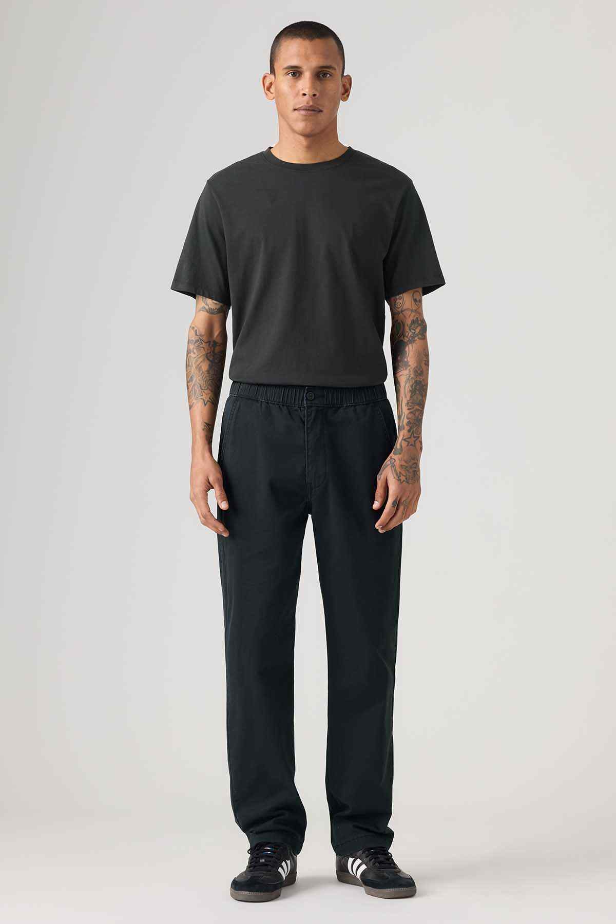 Men's black relaxed-fit pants with elastic waistband and side pockets