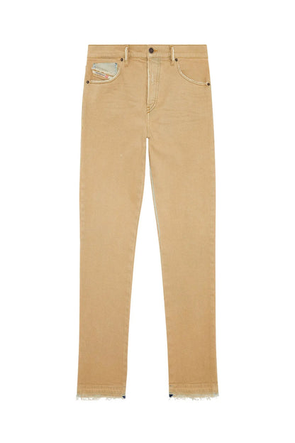 Beige straight jeans flat lay with frayed hems and distressed front pockets