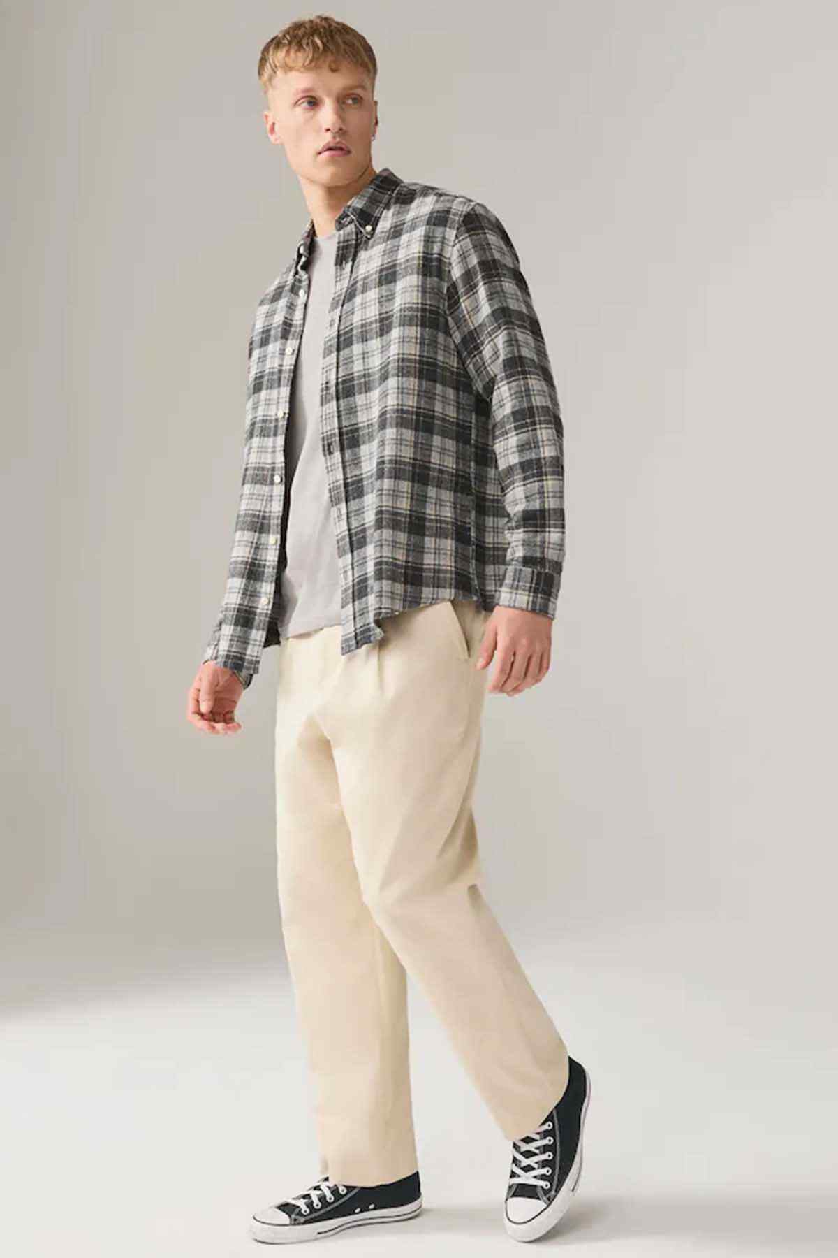 Light gray crew-neck short-sleeve T-shirt on model, side view