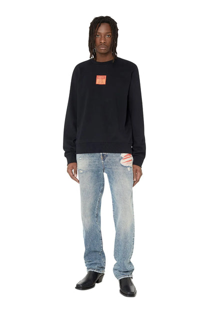 Black crewneck sweatshirt, long sleeves, red logo patch at center