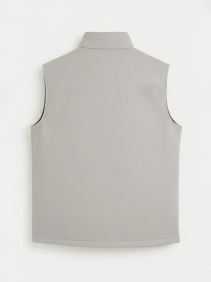 Beige sleeveless vest back view with high stand collar