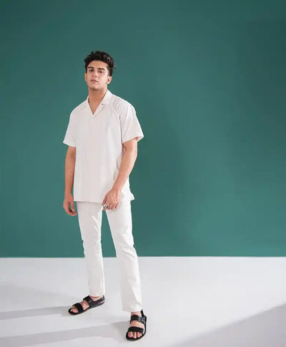 Off-white fitted short-sleeve shirt and matching straight-leg pants set