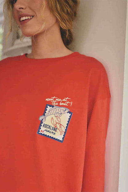 Red T-shirt with illustrated Rockland logo graphic on chest
