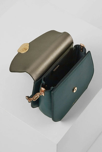 Teal crossbody bag with gold-tone zipper and hinge clasp, angled side view