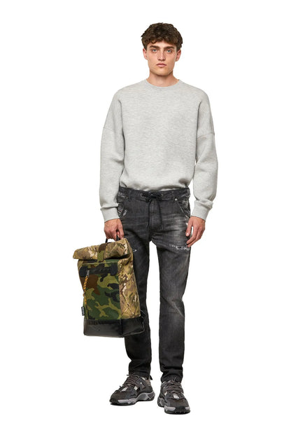 Men's black distressed jeans worn with sweatshirt, drawstring waist, straight legs