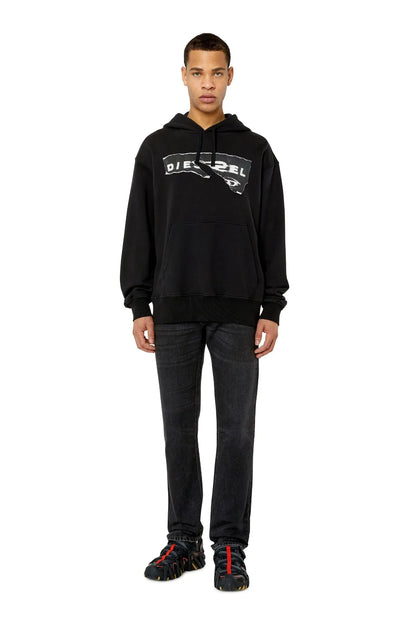 Diesel black straight-leg jeans on model with belt loops and cuffs