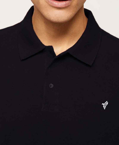Fitted dark polo shirt with fold-over collar and small chest logo embroidery.