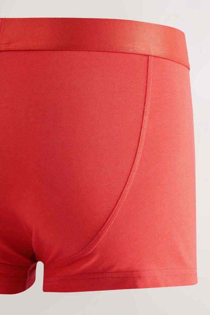 Red boxer briefs with curved seam detail and NEXT logo waistband