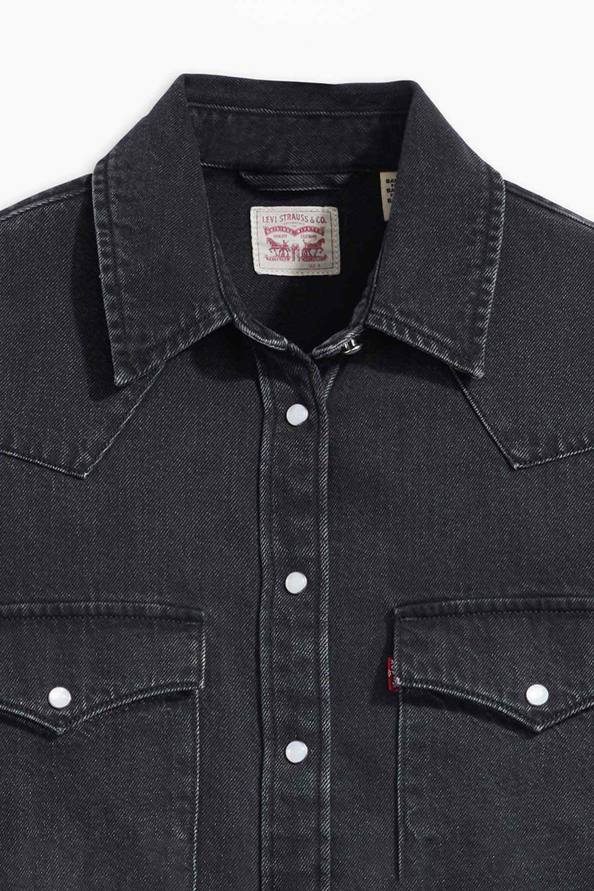 Black denim button-up shirt with pointed collar, front buttons, and chest pockets