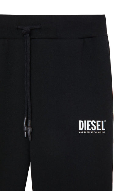 Black jogger pants close-up with drawstring waistband and DIESEL logo