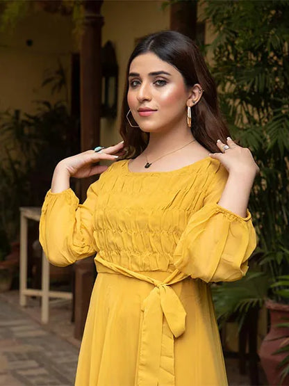 Nazmina yellow puff-sleeve dress close-up, square neckline, smocked bodice, bow tie