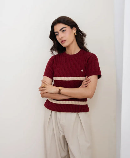 Red fitted knit crewneck top with short sleeves, cream stripe bands at mid-chest