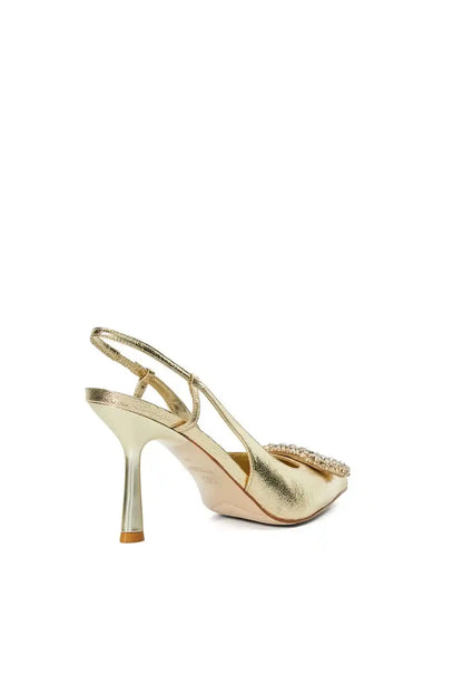 Gold metallic pointed-toe stiletto heels with slingback strap and jeweled detail