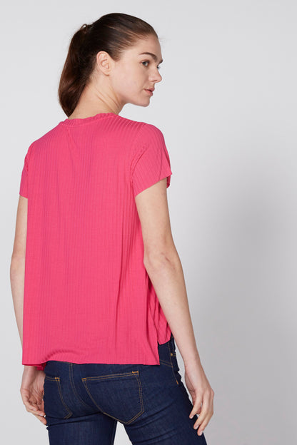 Pink short-sleeve crewneck knit top, side view