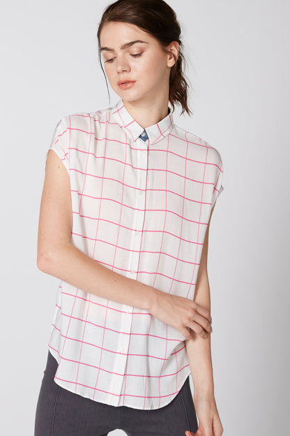 Pink grid-striped short-sleeve polo shirt, front view with button placket and collar