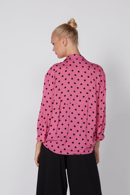 Pink polka-dot blouse back view with long sleeves