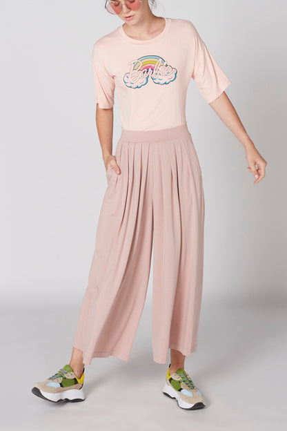 Pink graphic T-shirt and flowy wide-leg pants, gathered elastic waist