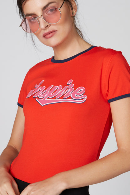 Red short-sleeve T-shirt with navy trim and 'Inspire' script logo across chest