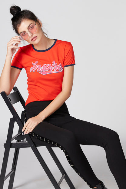 Red short-sleeve T-shirt with navy trim and 'Inspire' script logo