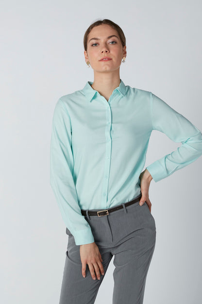 Light turquoise collared button-up shirt with long sleeves and buttoned front
