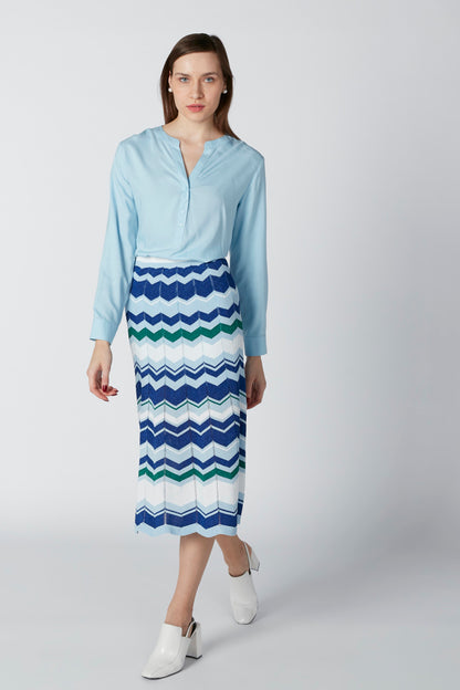 Light blue button-front blouse, 3/4 sleeves, with chevron striped skirt