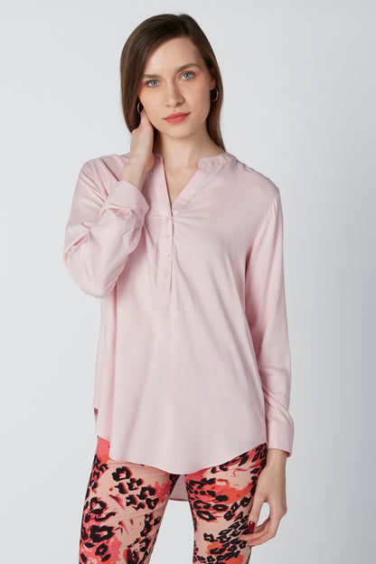 Pink long-sleeve button-up blouse with collar and button placket
