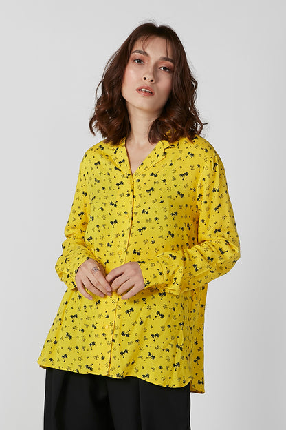 Yellow printed button-up blouse with long sleeves