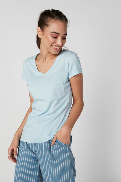 Light blue V-neck short-sleeve top with blue striped wide-leg pants