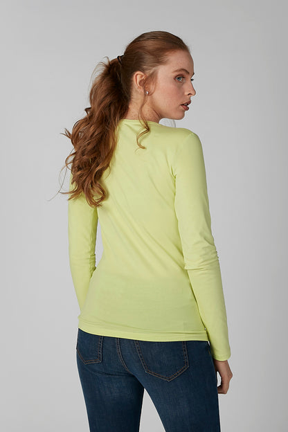 Lime green long-sleeve crewneck shirt, side view showing slim fit