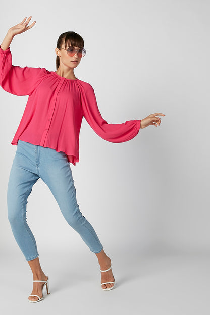 Pink long-sleeve blouse with gathered neckline and button front