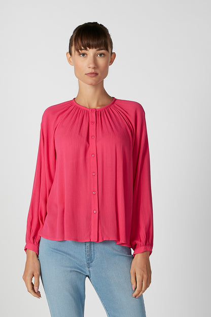 Pink button-front blouse with gathered collar and long sleeves