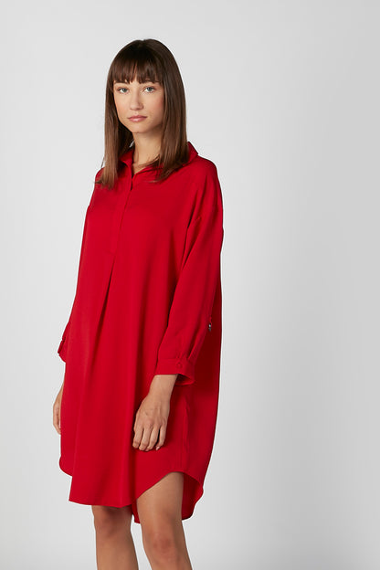 Red hooded long-sleeve dress, side view, above-knee hem