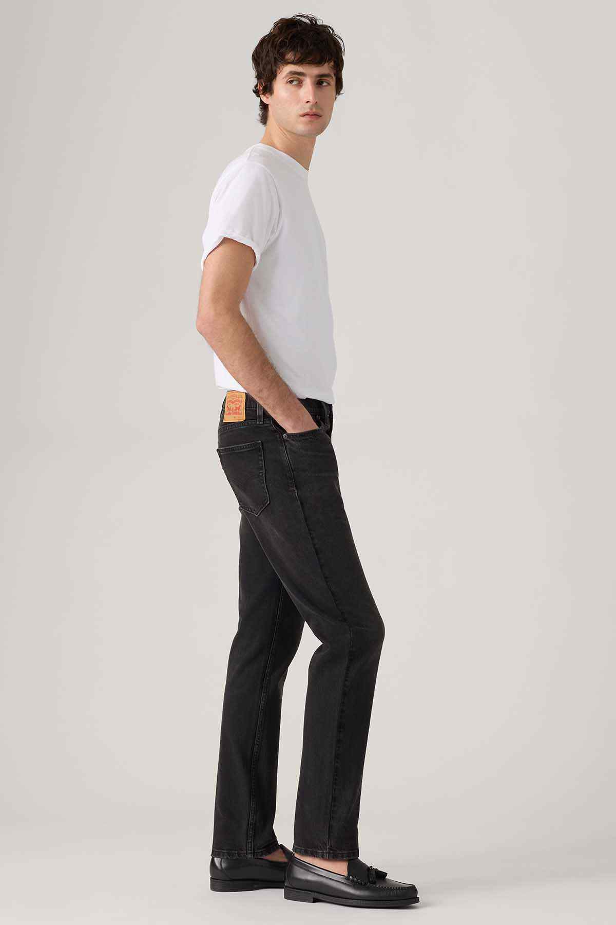 Levi's black denim jeans, side view, straight leg with contrast stitching