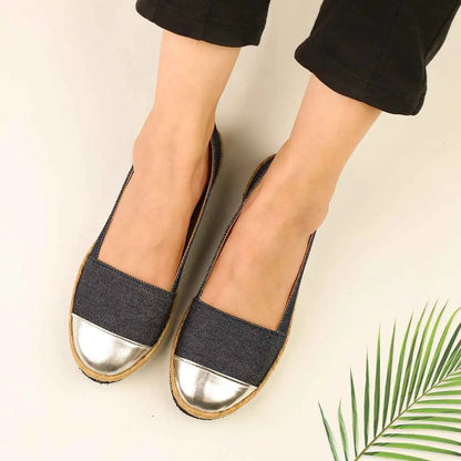 Blue denim slip-on flats with silver metallic toe and flat sole