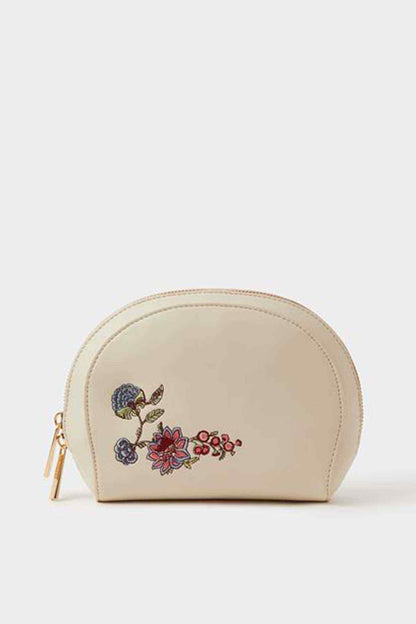 Cream half-moon pouch with floral embroidery and gold zip pull
