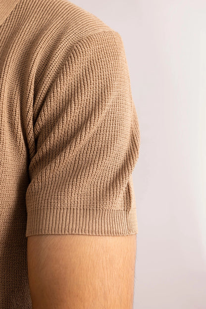 Brown knit polo shirt sleeve with ribbed cuff and textured knit pattern