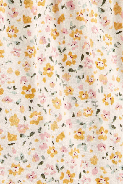 Floral print fabric close-up with soft pastel flowers and leaves