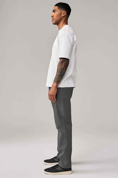 Dark grey trousers in a straight fit, side view with hem and crease