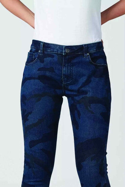Blue camouflage denim jeans close-up: mid-rise waistband with front pockets and belt loops