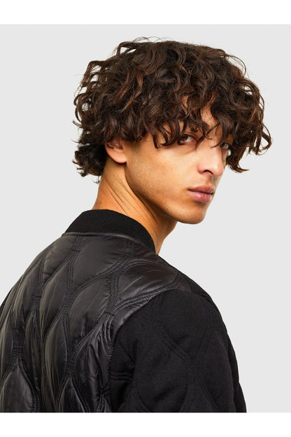 Black quilted bomber jacket side, diamond stitch pattern and sleeve