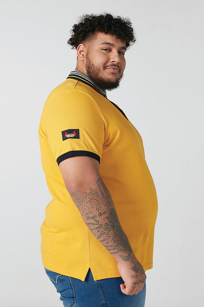 Men's yellow polo shirt with striped collar and embroidered sleeve patch